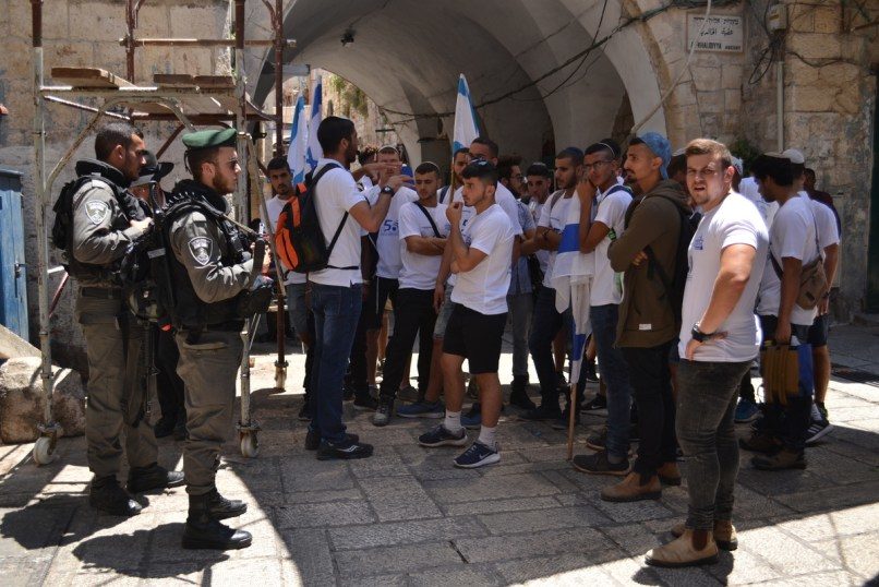 Well protected Israeli youth tour old Jerusalem
