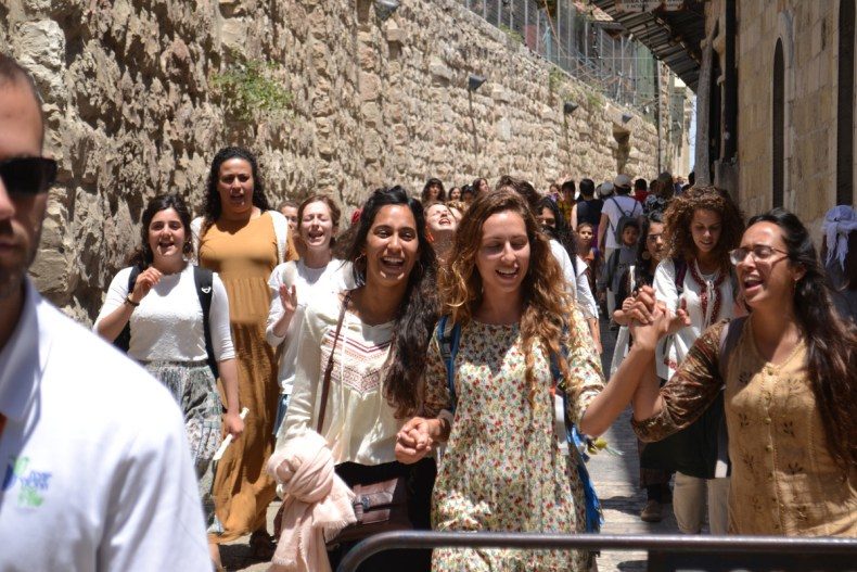 Click to enlarge Young women sing ecstatically