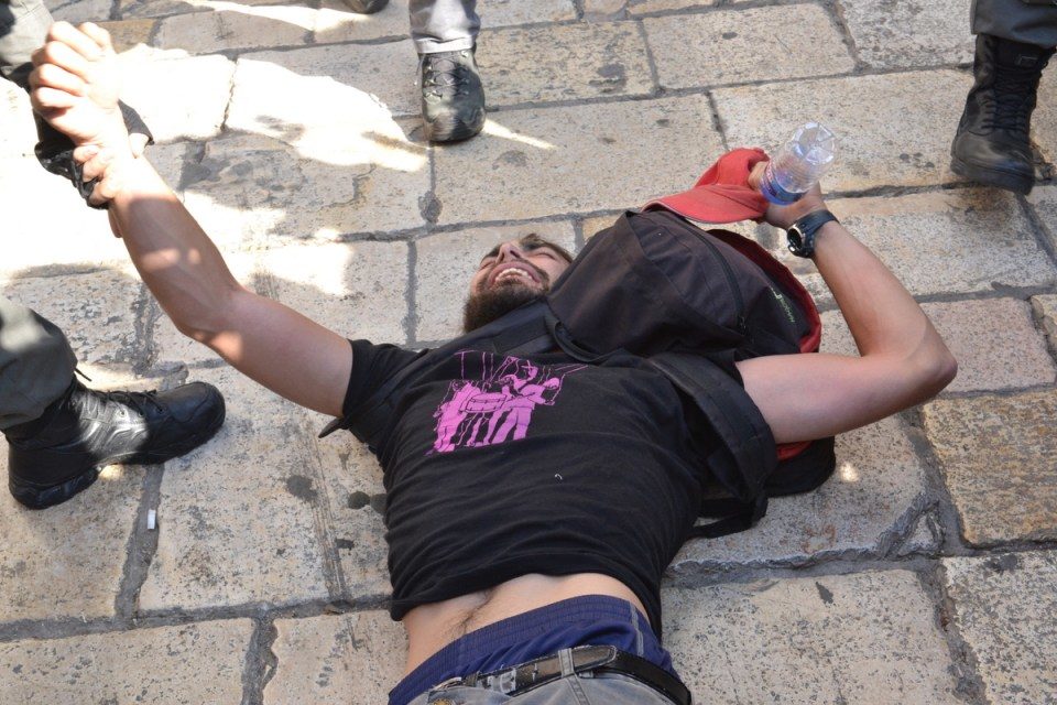 orcefully clearing the plaza of onlookers and journalists