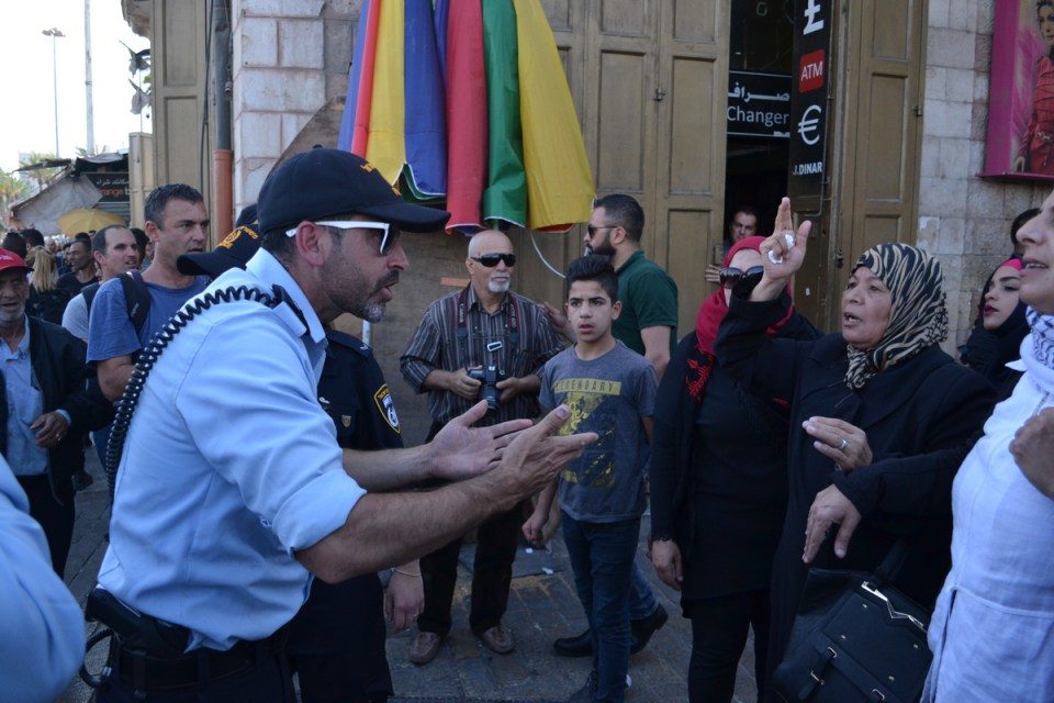 large crowd of Palestinians had gathered, chanting and waving flags