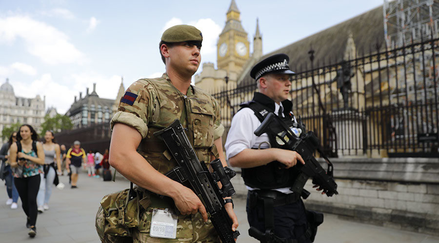 Click to enlarge British soldier and police