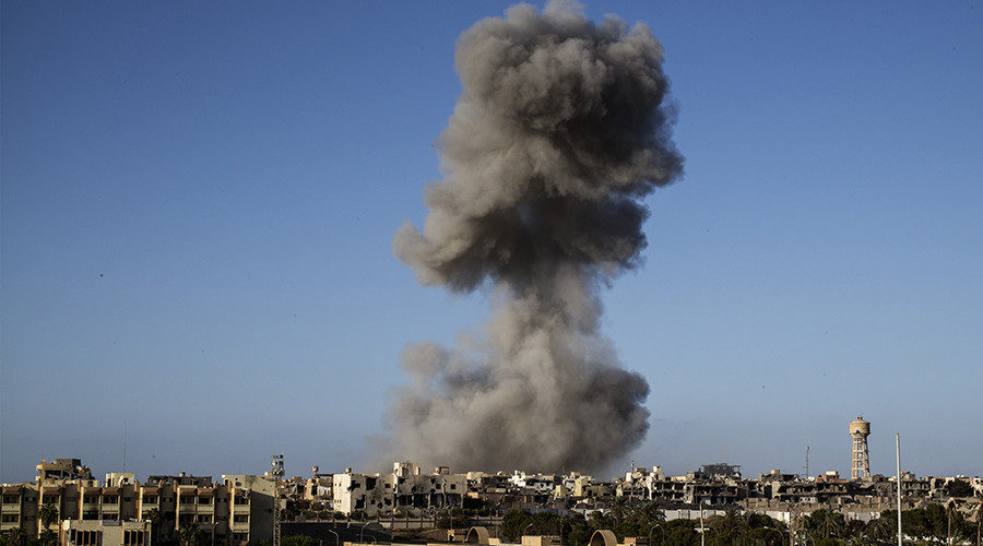 Click to enlarge Smoke rise after an airstrike on the District 3 of Sirte, on September 28, 2016