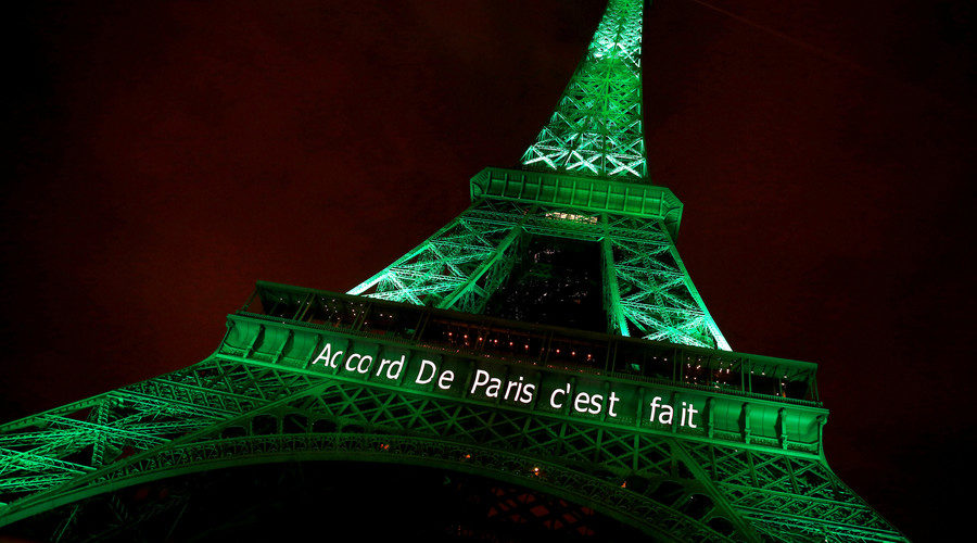 Click to enlarge The Eiffel tower is illuminated in green with the words