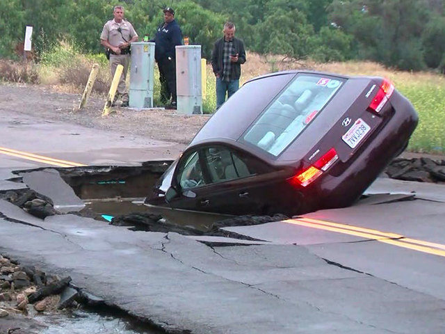 car in sinkhole