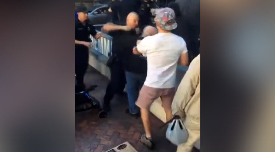 cop hitting man