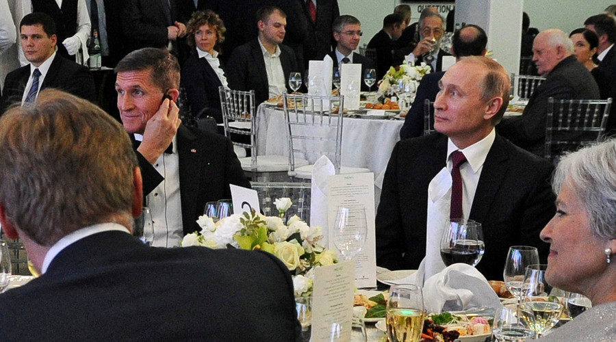 Russian President Vladimir Putin (R) sits next to retired U.S. Army Lieutenant General Michael Flynn (L), December 10, 2015.
