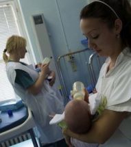 nurse feeding baby