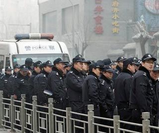 Police officers stand guard-China