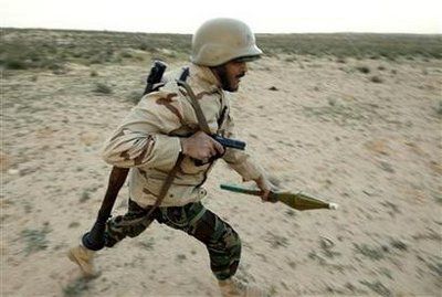 A rebel soldier runs