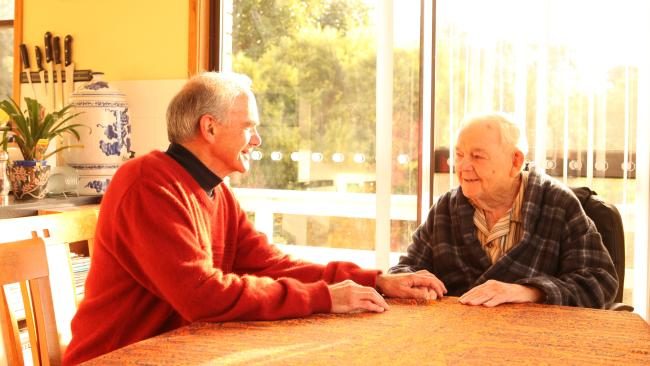 Click to enlarge Dr Michael Barbato with a patient