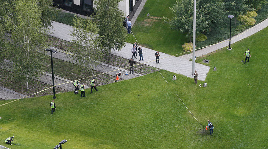 Police investigate the scene of an explosion in the U.S. embassy compound in Kiev
