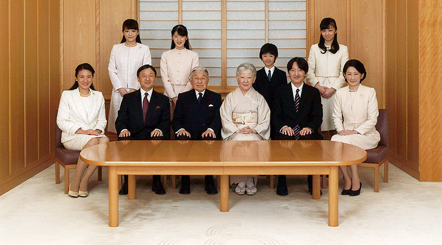 Japanese Emperor Akihito (seated 3rd L) and Empress Michiko (seated 4th L), smile with their family members