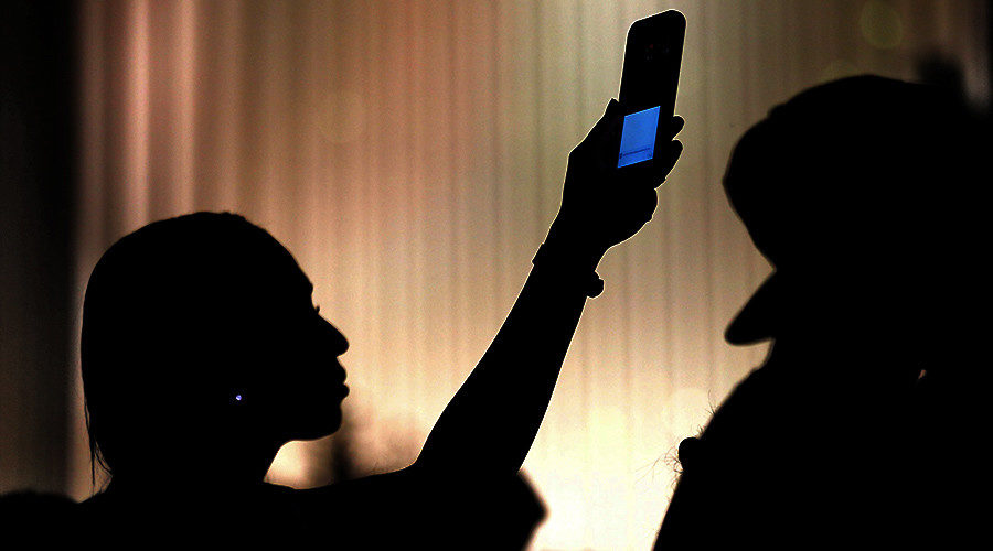holding cell phone