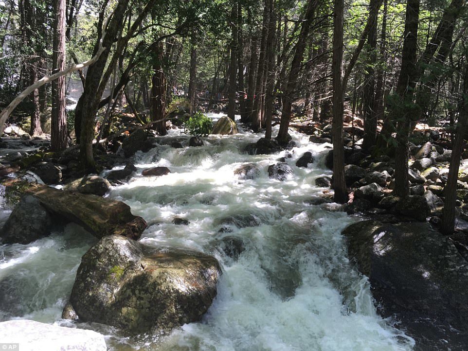 In this photo taken May 25, 2017, the water in Bridalveil Creek rushes through boulders at Yosemite National Park, Calif. 