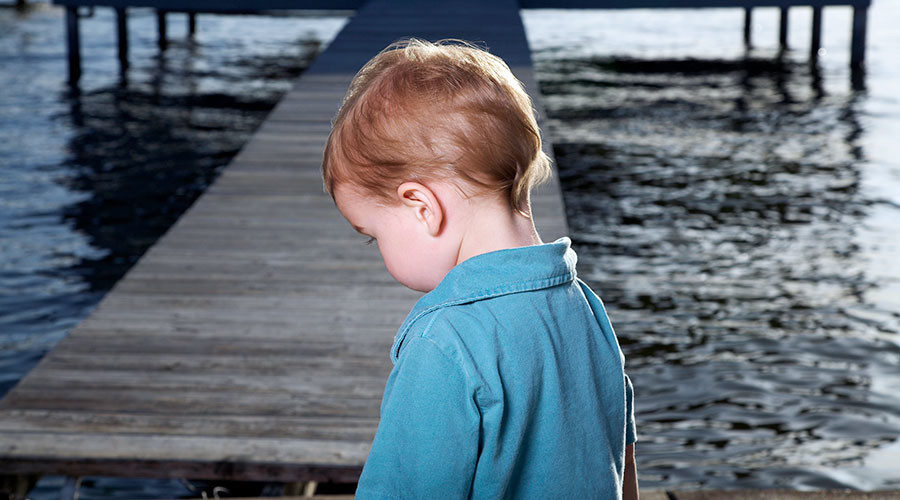 child on pier