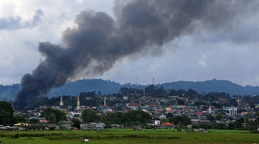 Smoke billows from a burning building