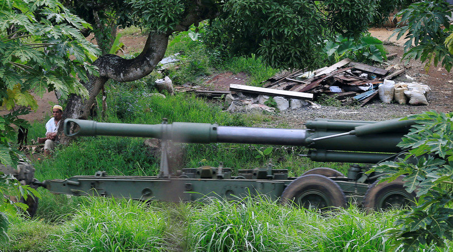 Click to enlarge A military vehicle carrying a 155mm towed howitzer , Marawi City