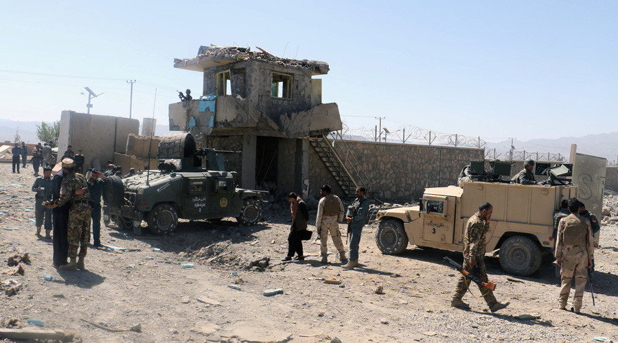 Click to enlarge Afghan security forces inspect the aftermath of a suicide bomb blast in Paktia Province