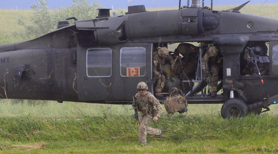 US Army soldiers disembark from a Black Hawk helicopter during the Suwalki Gap exercise