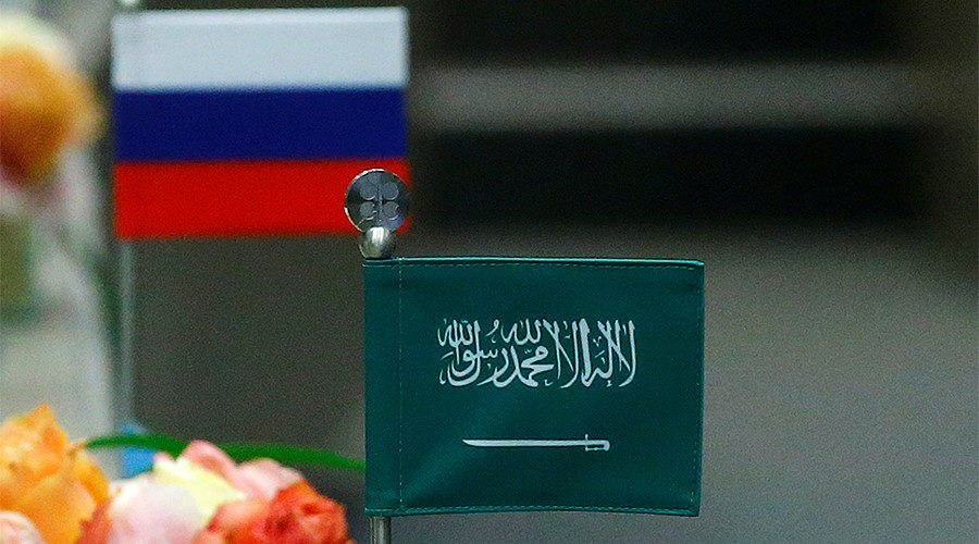 Click to enlarge Russian and Saudi Arabia flag placards