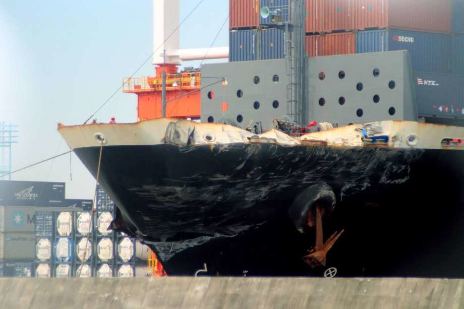 container ship ACX Crystal with its left bow dented