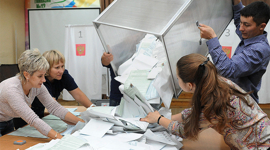 Click to enlarge Members of an election commission during the vote count at a polling station, Russia