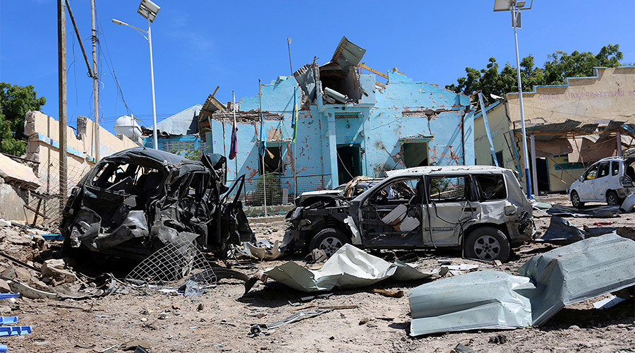 Click to enlarge destruction and wreckages of cars after an attack on a government building in Mogadishu