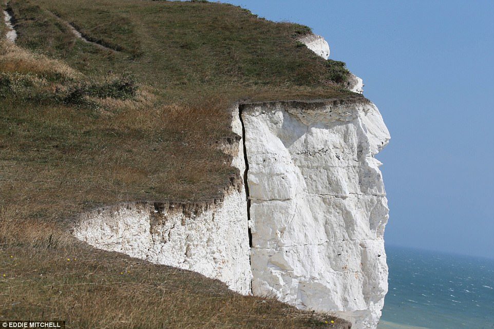 Click to enlarge A third cliff (pictured) then came crashing into the sea, leading to the Coastguard issuing a warning