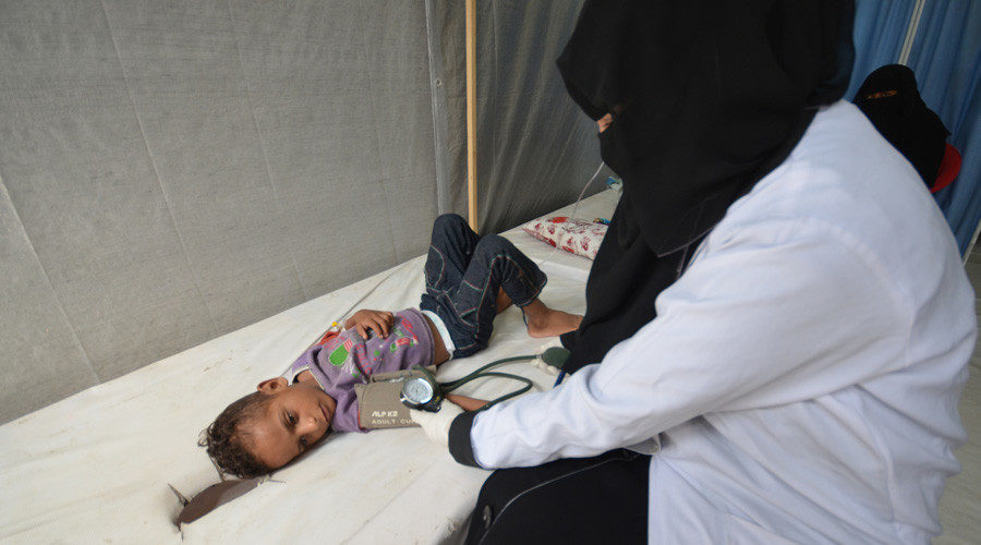 Nurse attends to a boy infected with cholera at a hospital in the Red Sea port city of Hodeidah, Yemen