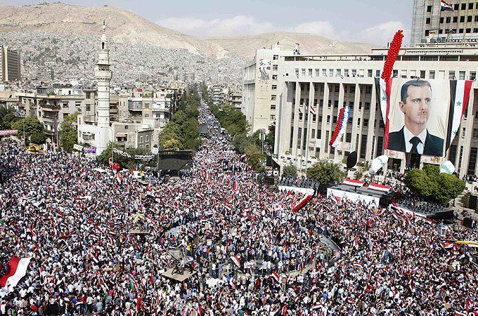 Click to enlarge October 2011 – Tens of thousands of Syrians have rallied in central Damascus in show of support for President Bashar al-Assad