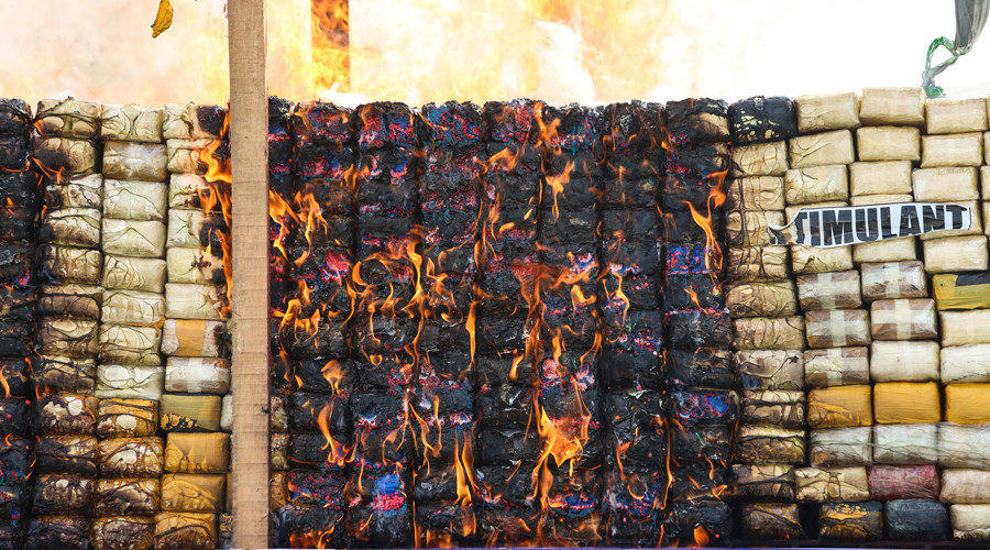 Seized drugs are burnt by Myanmar police during a ceremony on the outskirts of Yangon