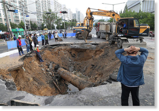 An emergency operation is under way to restore the collapsed road.