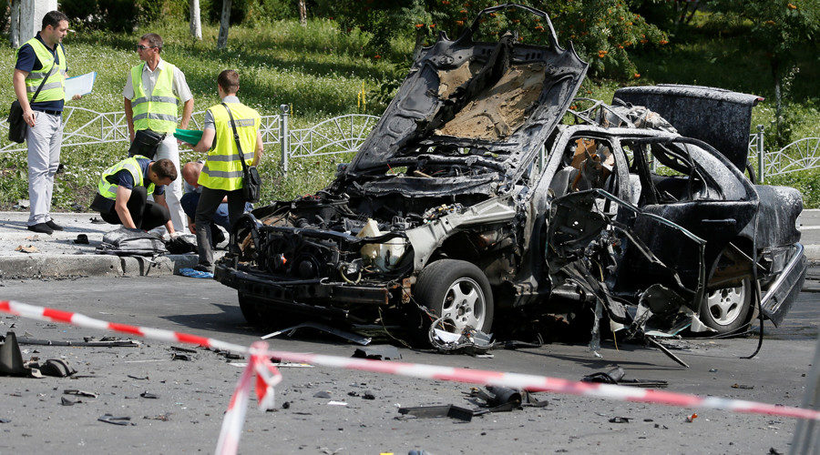 Investigators work at the scene of a car bomb explosion which killed Maxim Shapoval, a high-ranking official involved in military intelligence, in Kiev