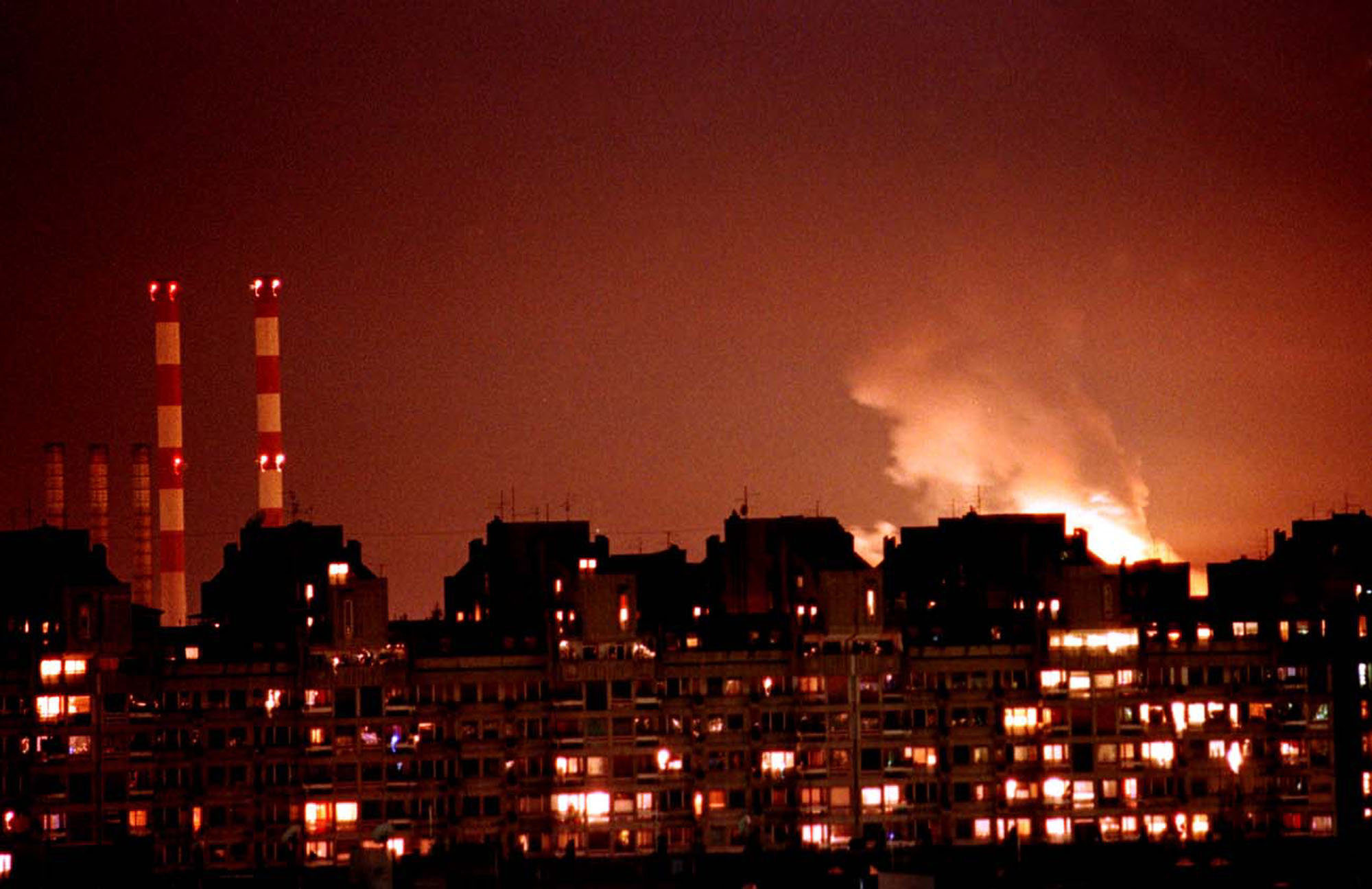 Flames from an explosion light up the Belgrade skyline