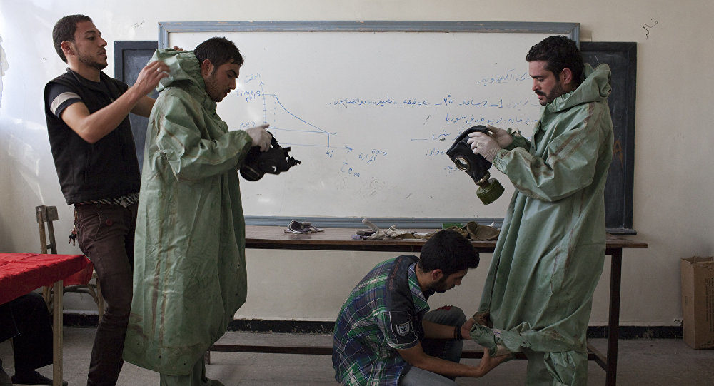 Aleppo university students donning chemical suits