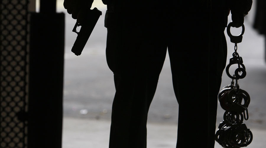 Click to enlarge cop with a gun and handcuffs