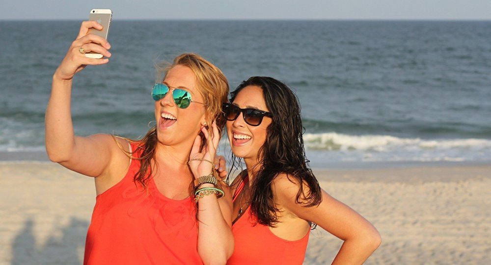 women selfie on beach