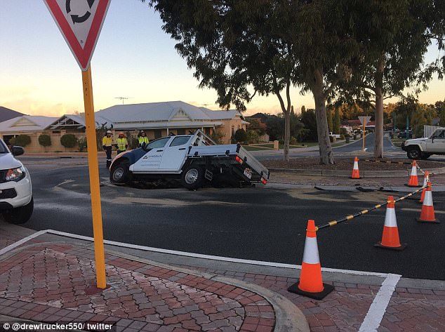 A sinkhole swallowed his ute , forcing him to climb out the passenger side