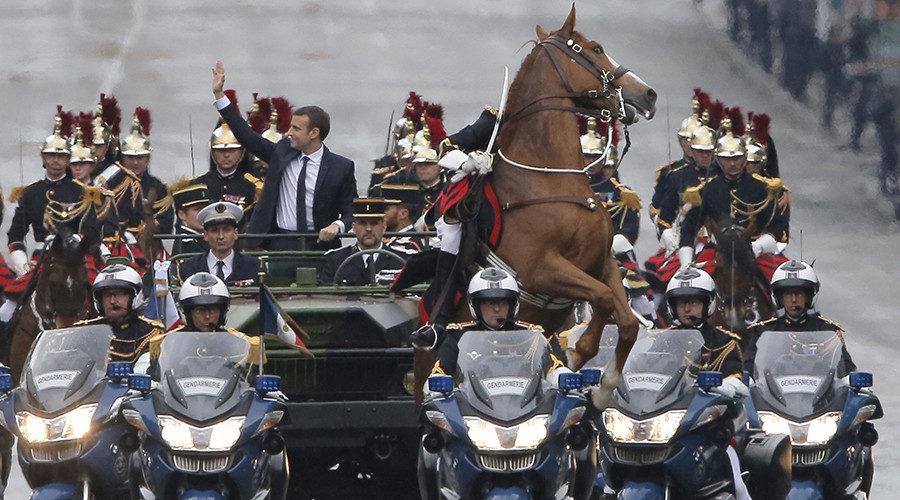 Emmanuel Macron parades in a car on the Champs Elysees
