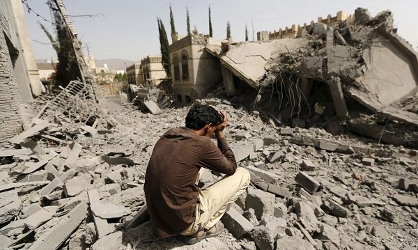 Syrian man with head in hands