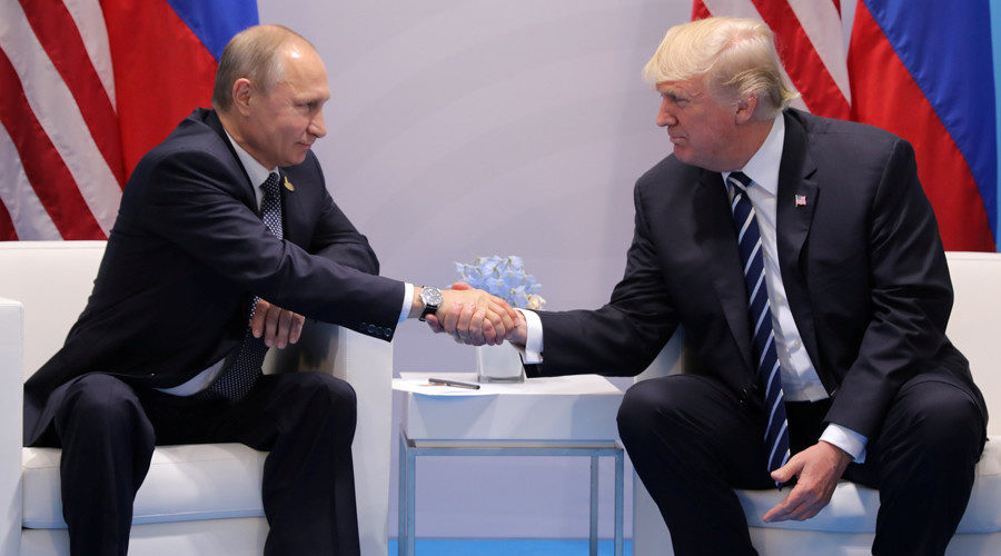 Russia's President Vladimir Putin shakes hands with U.S. President Donald Trump