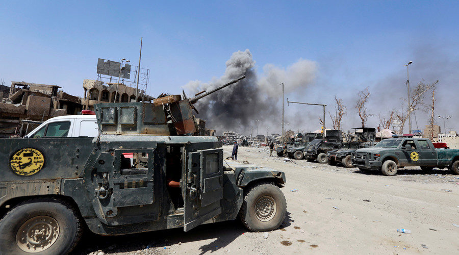 Smoke rises from an air strike during fighting with Islamic State militants in the Old City of Mosul