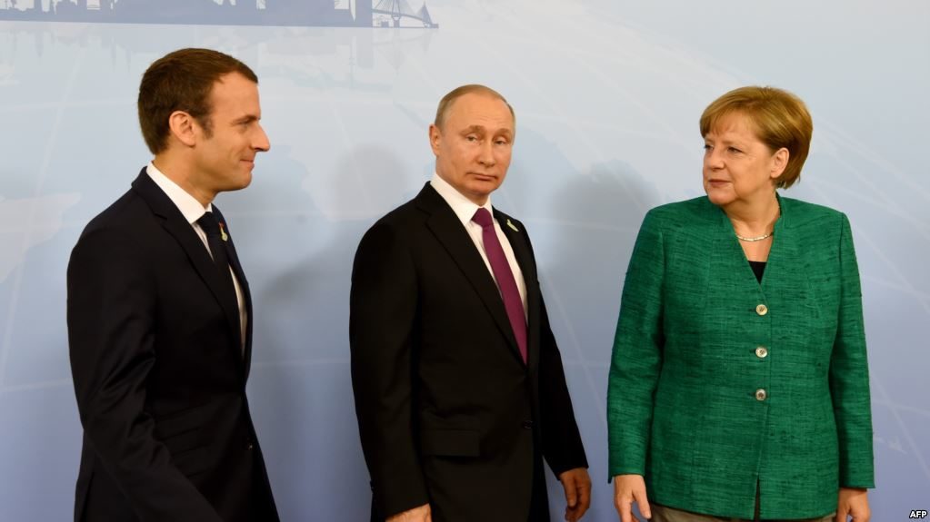 Emmanuel Macron, Vladimir Putin and Angela Merkel