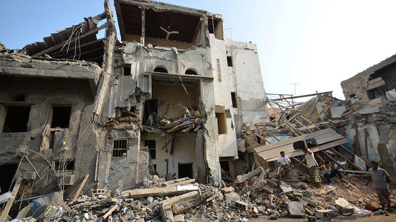 Click to enlarge People gather at the site of a Saudi-led air strike