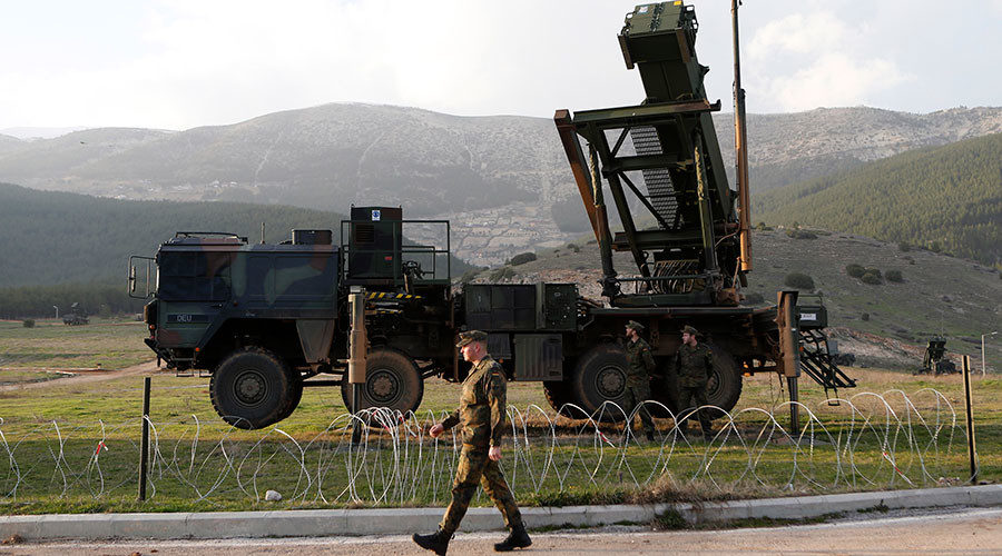Click to enlarge Soldiers of the German armed forces Bundeswehr stand next to the Patriot system