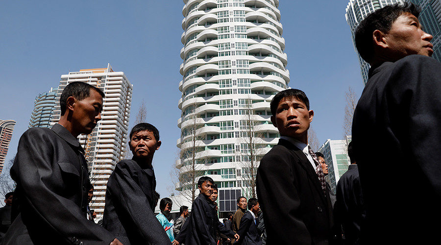 People walk in Ryomyong street in Pyongyang