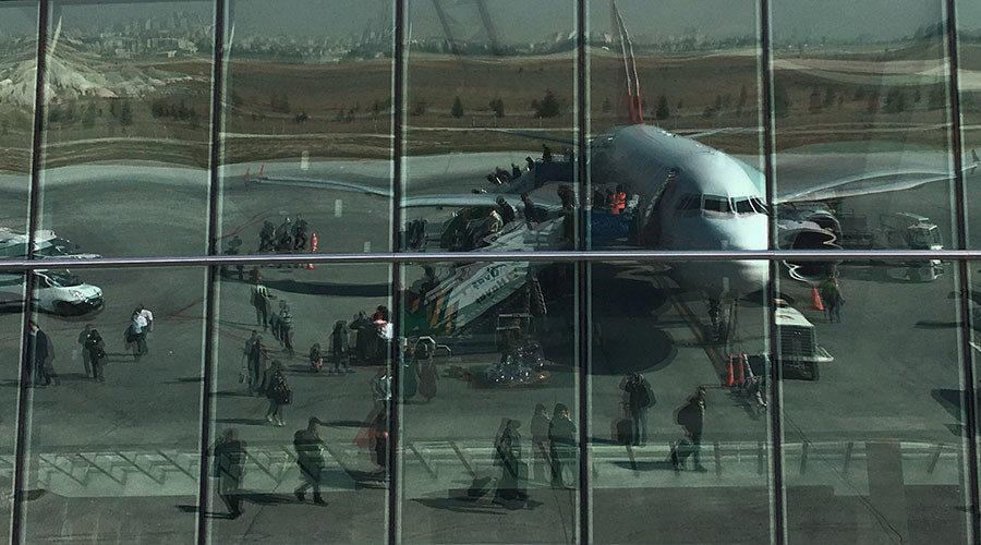 Turkish airport reflected in window