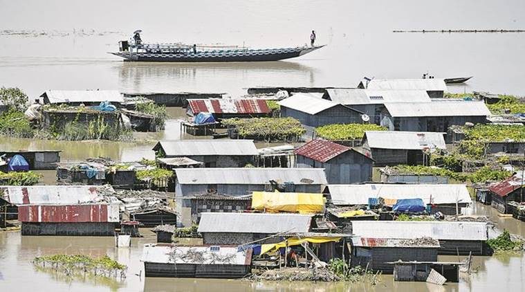 Partially submerged houses in Morigaon district of Assam, Friday