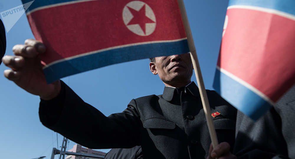 man holding Korea flags