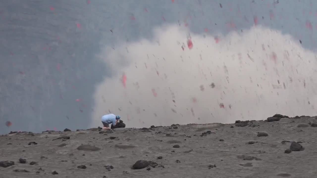 Volcano erupts in front of man
